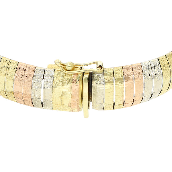 Pulsera eslabón laminado en oro tres tonos 14 kilates.