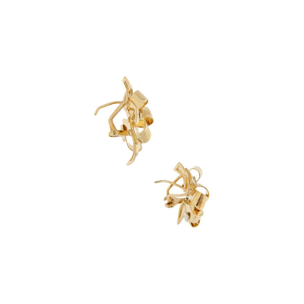 Aretes laminados motivo moño en oro amarillo 14 kilates.
