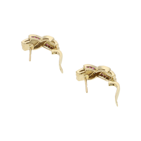 Aretes diseño especial con diamantes y rubíes en oro amarillo 14 kilates.