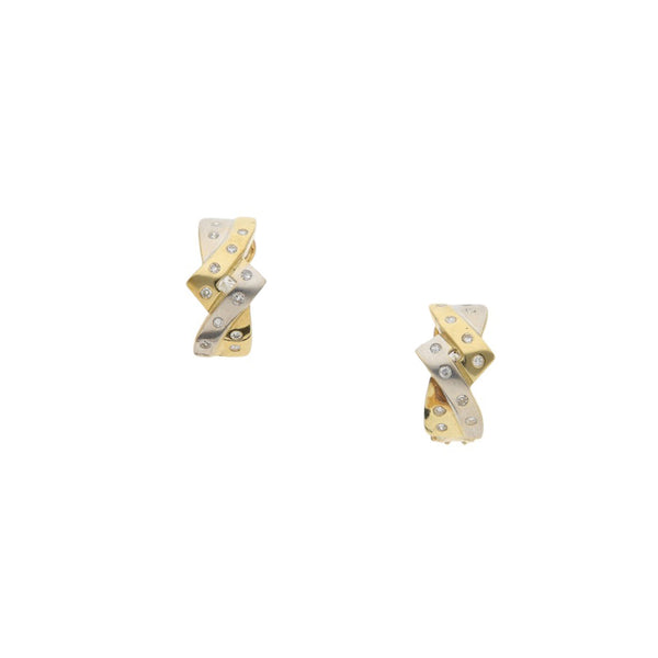 Aretes diseño especial con diamantes en oro amarillo 14 kilates.
