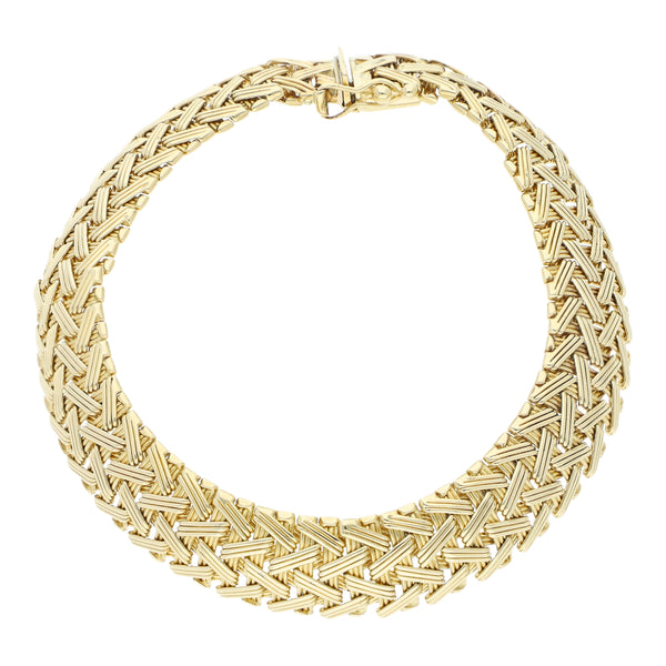 Pulsera eslabón tejido en oro amarillo 14 kilates.