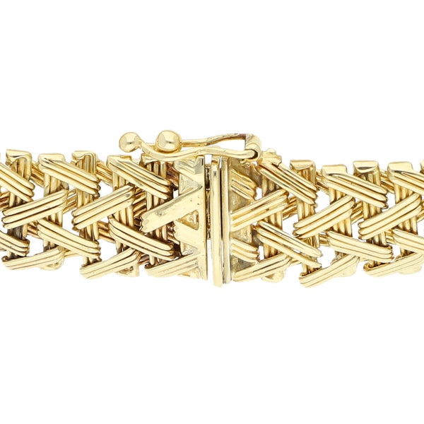 Pulsera eslabón tejido en oro amarillo 14 kilates.
