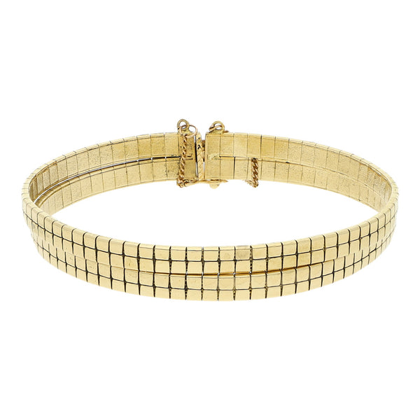 Pulsera de dos hilos eslabón articulado en oro amarillo 18 kilates.