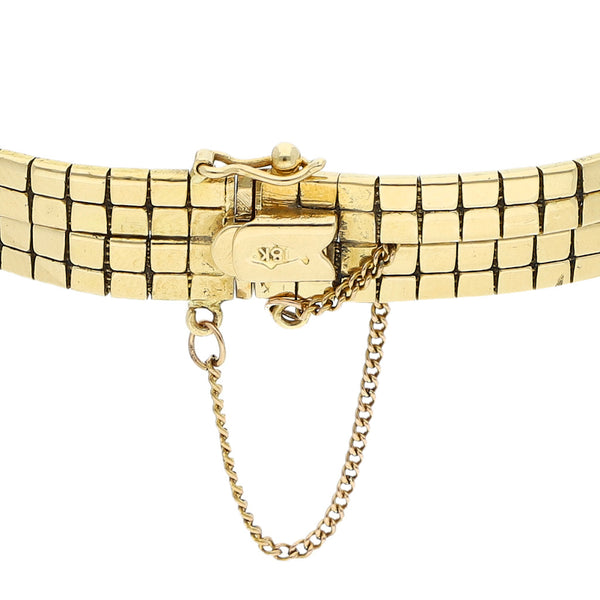Pulsera de dos hilos eslabón articulado en oro amarillo 18 kilates.