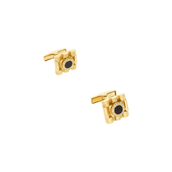 Mancuernillas estriadas con diamantes y ónix en oro amarillo 18 kilates.