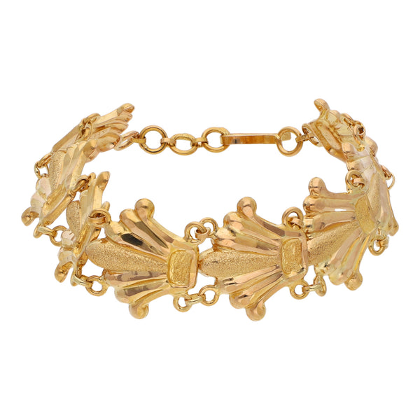Pulsera eslabón articulado motivo coronas en oro amarillo 21 kilates.