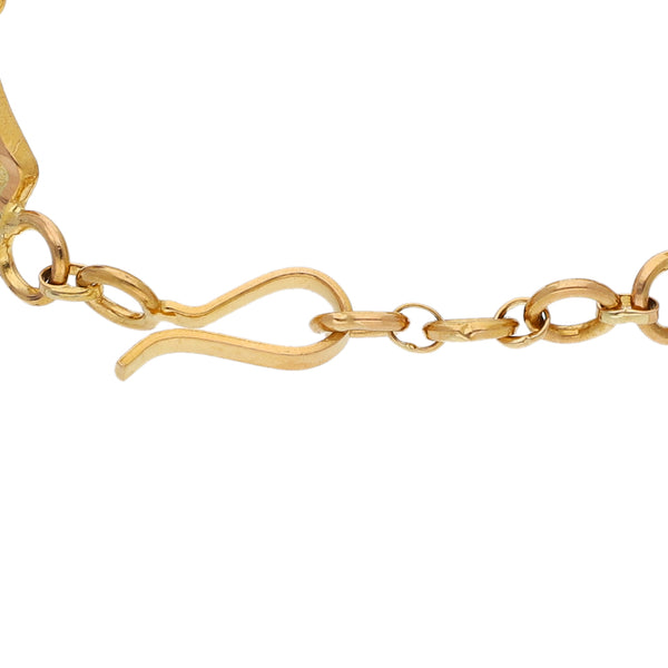 Pulsera eslabón articulado motivo coronas en oro amarillo 21 kilates.