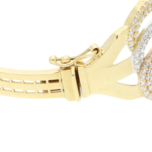 Pulsera de arillo articulada con circonias en oro tres tonos 14 kilates.