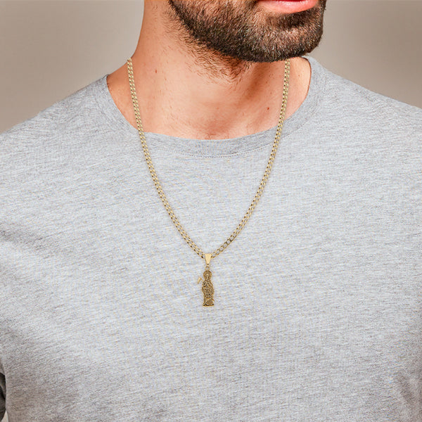 Collar eslabón encontrado y dije motivo muerte en oro amarillo 14 kilates.