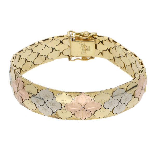 Pulsera eslabón articulado en oro tres tonos 18 kilates.