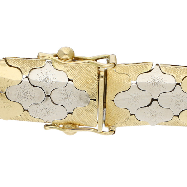 Pulsera eslabón articulado en oro tres tonos 18 kilates.