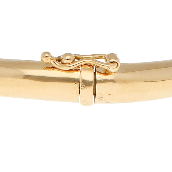 Pulsera de arillo articulada firma Tane en oro amarillo 18 kilates