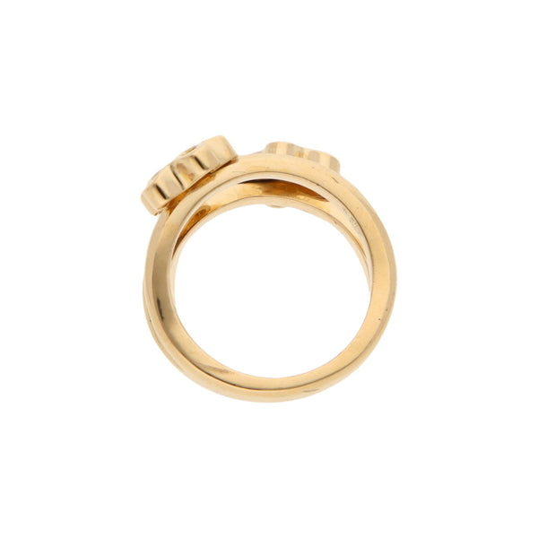 Anillo estilizado motivo flores con diamantes en oro amarillo 18 kilates.