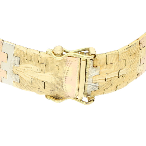 Pulsera eslabón laminado en oro tres tonos 18 kilates.