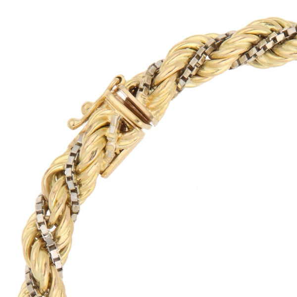 Pulsera eslabón torzal en oro dos tonos 18 kilates.