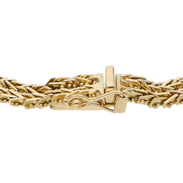 Pulsera de dos hilos eslabón boleado en oro tres tonos 18 kilates.