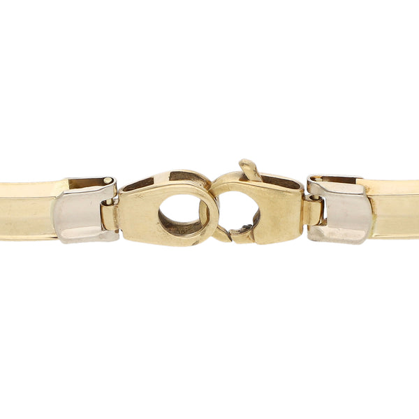 Pulsera eslabón articulado en oro dos tonos 14 kilates.