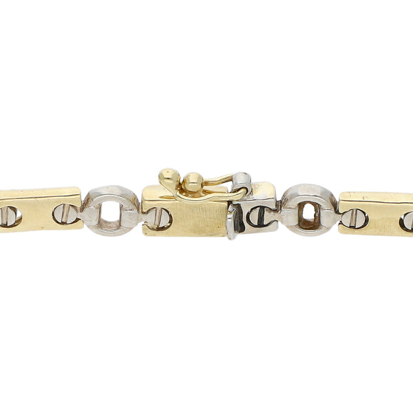 Pulsera eslabón articulado en oro dos tonos 14 kilates.
