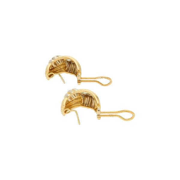 Aretes estriados en oro dos tonos 18 kilates.