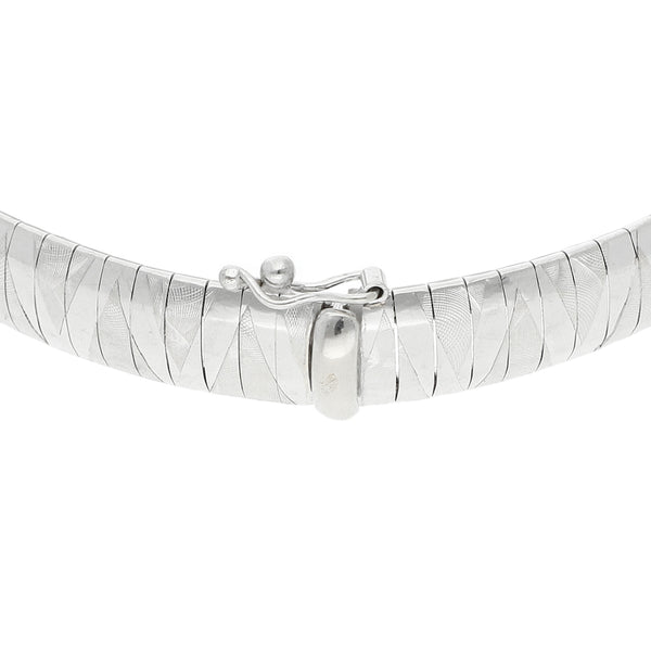 Pulsera eslabón laminado en oro blanco 14 kilates.