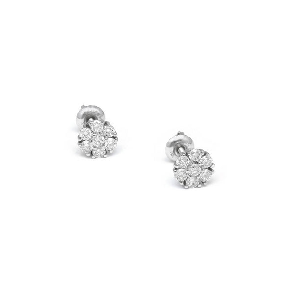 Aretes diseño especial motivo flor con diamantes en oro blanco 14 kilates.