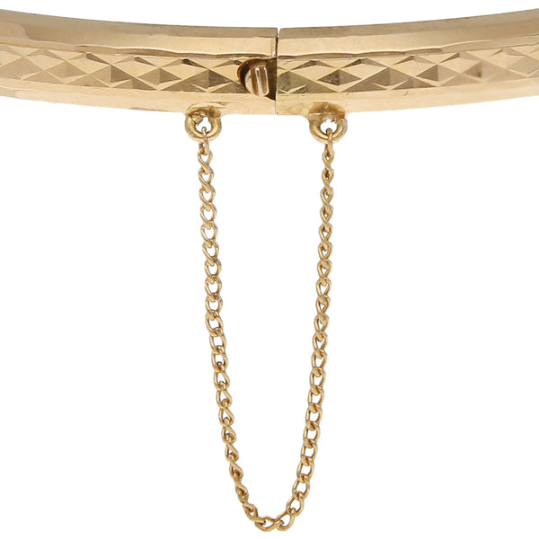 Pulsera de arillo facetada en oro amarillo 18 kilates.