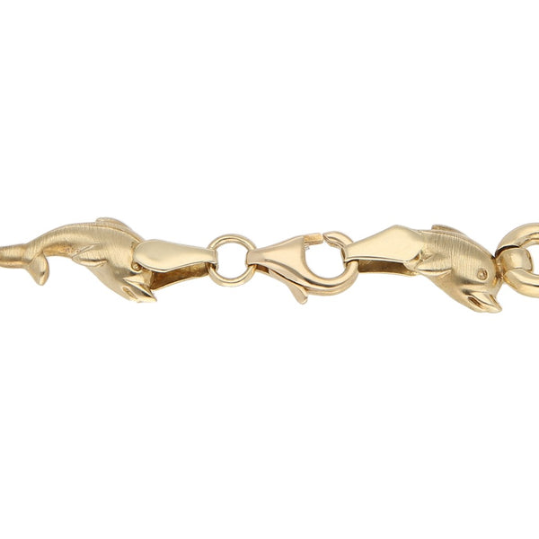 Pulsera eslabón articulado con aplicaciones motivo delfín en oro dos tonos 14 kilates.
