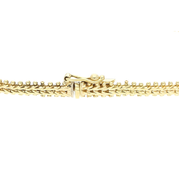 Pulsera eslabón boleado con aplicaciones en oro tres tonos 14 kilates.