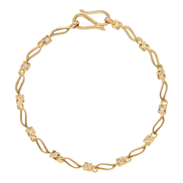 Pulsera eslabón articulado con circonias en oro amarillo 22 kilates.