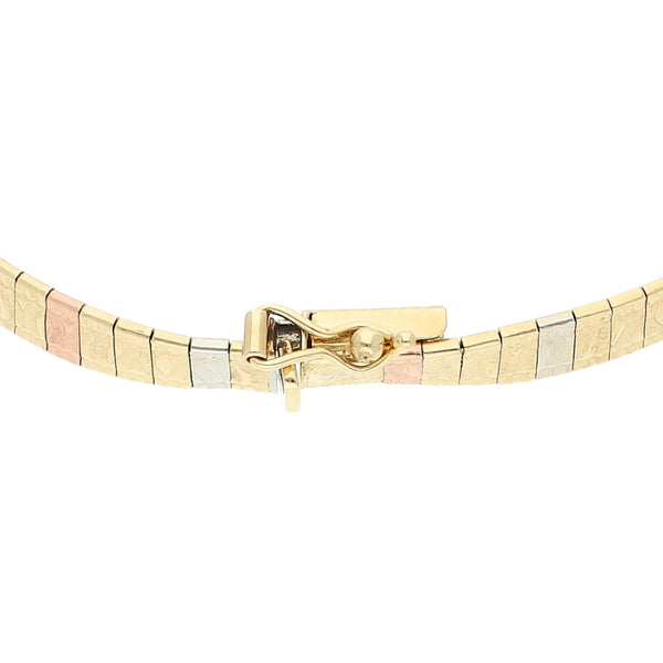 Pulsera eslabón laminado en oro tres tonos 14 kilates.