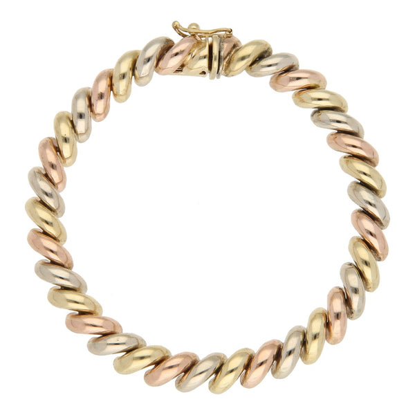 Pulsera eslabón articulado en oro tres tonos 14 kilates.