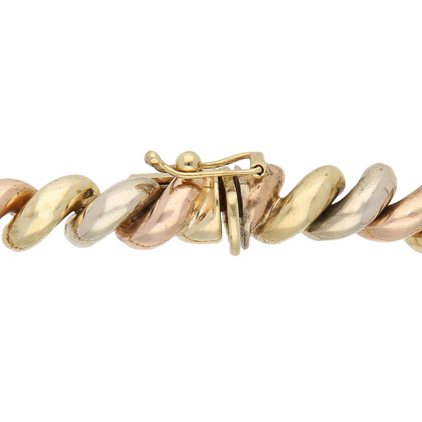 Pulsera eslabón articulado en oro tres tonos 14 kilates.