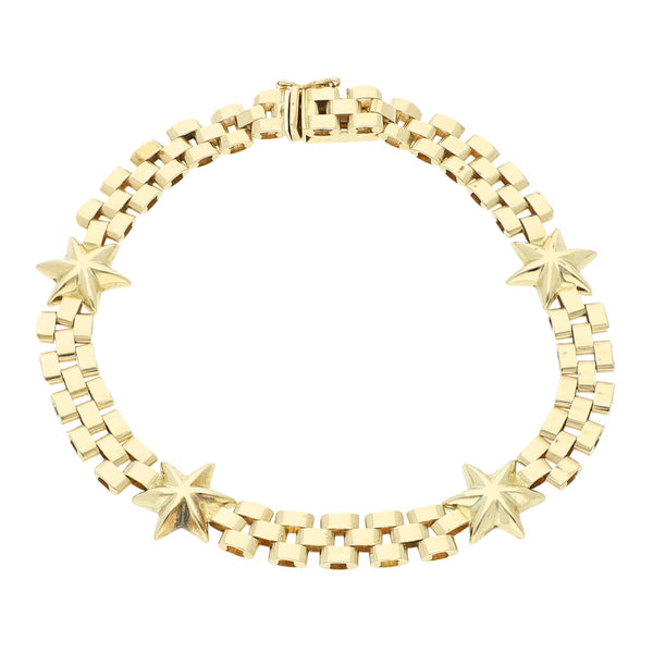 Pulsera eslabón articulado con aplicaciones motivo estrella en oro amarillo 14 kilates.