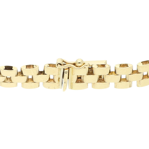 Pulsera eslabón articulado con aplicaciones motivo estrella en oro amarillo 14 kilates.