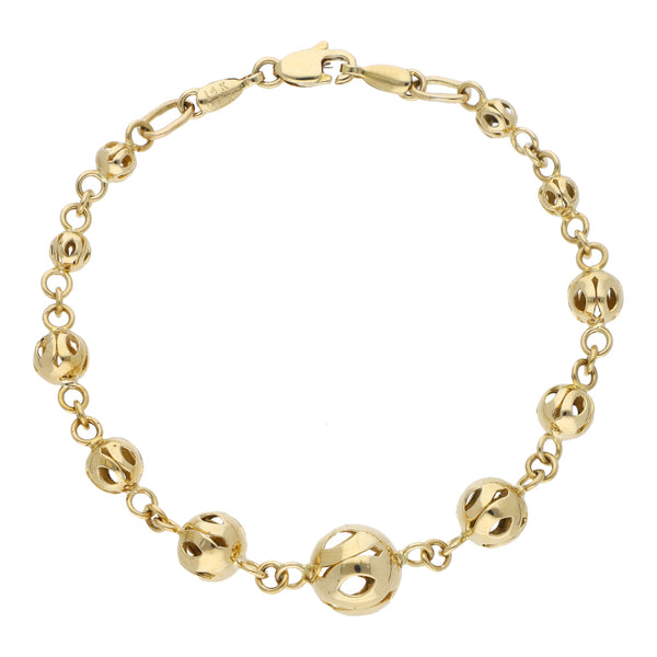 Pulsera eslabón cruzado con aplicaciones motivo esfera en oro amarillo 14 kilates.
