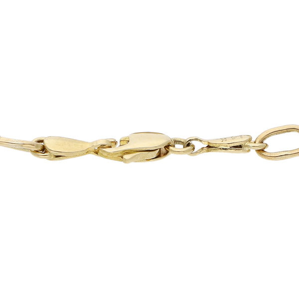 Pulsera eslabón cruzado con aplicaciones motivo esfera en oro amarillo 14 kilates.