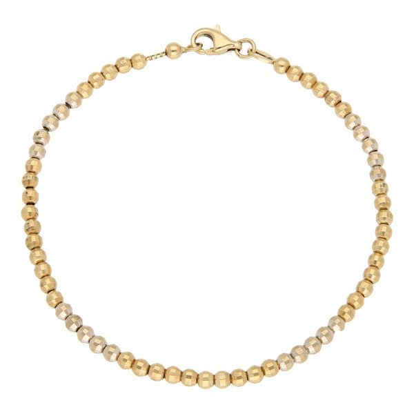 Pulsera eslabón cuadrado cruzado con aplicaciones en oro dos tonos 14 kilates.