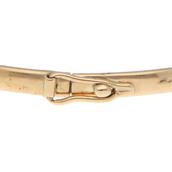 Pulsera de arillo lisa en oro amarillo 14 kilates.