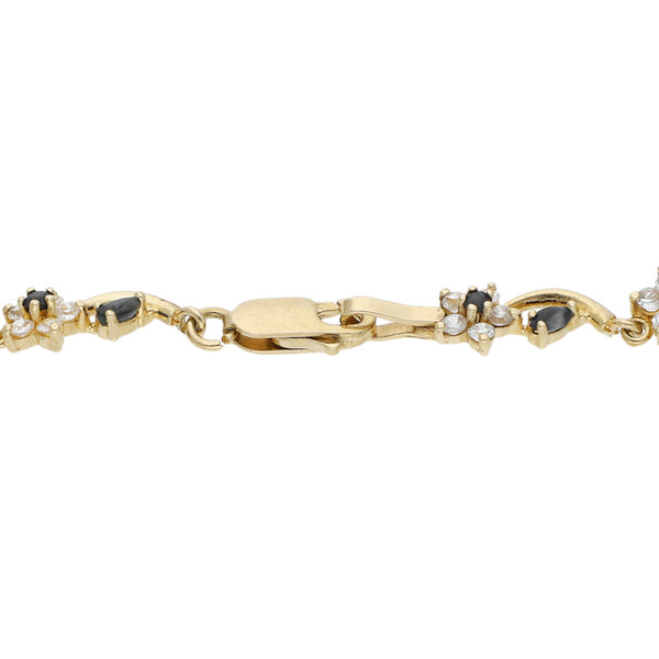 Pulsera eslabón articulado motivo flor con circonias en oro amarillo 14 kilates.