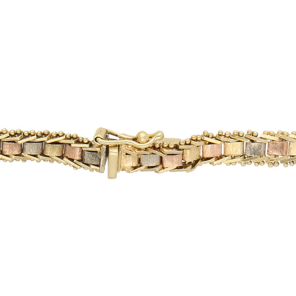 Pulsera eslabón boleado en oro tres tonos 14 kilates.