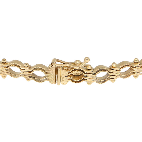Pulsera eslabón articulado en oro amarillo 14 kilates.