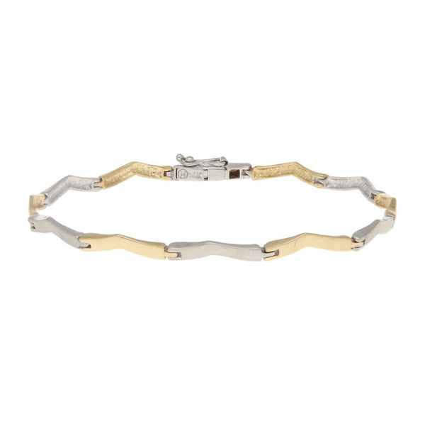 Pulsera eslabón articulado en oro tres tonos 14 kilates.