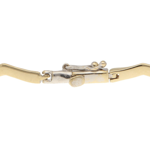 Pulsera eslabón articulado en oro tres tonos 14 kilates.