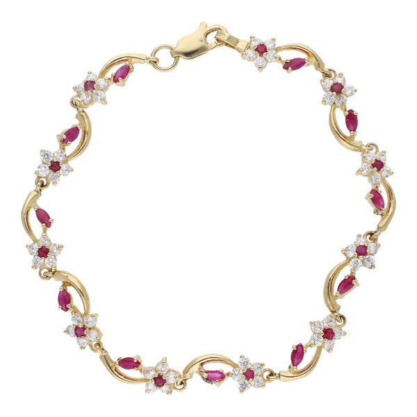 Pulsera eslabón articulado motivo flores con rubíes y circonias en oro amarillo 14 kilates.