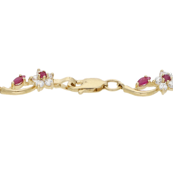 Pulsera eslabón articulado motivo flores con rubíes y circonias en oro amarillo 14 kilates.