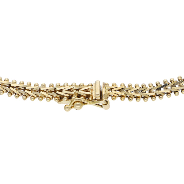 Pulsera eslabón boleado en oro tres tonos 14 kilates.