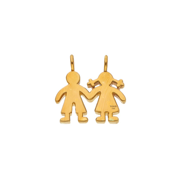 Dije hueco motivo niños firma Tous en oro amarillo 18 kilates.