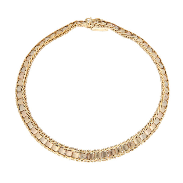 Pulsera eslabón boleado en oro tres tonos 14 kilates.
