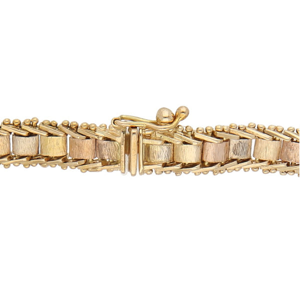 Pulsera eslabón boleado en oro tres tonos 14 kilates.