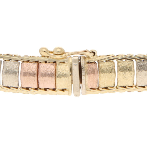 Pulsera eslabón planchado en oro tres tonos 14 kilates.